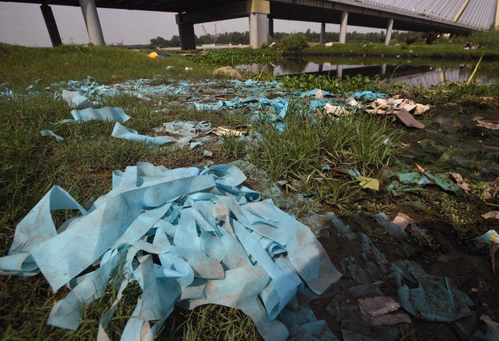 Biomedical waste dumped near the Yamuna river near Signature Bridge on July 27, 2020 in New Delhi.