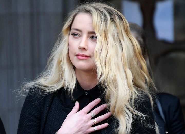 Amber Heard, former wife of actor Johnny Depp, gives a statement after the end of the trial outside the High Court in London on July 28, 2020,