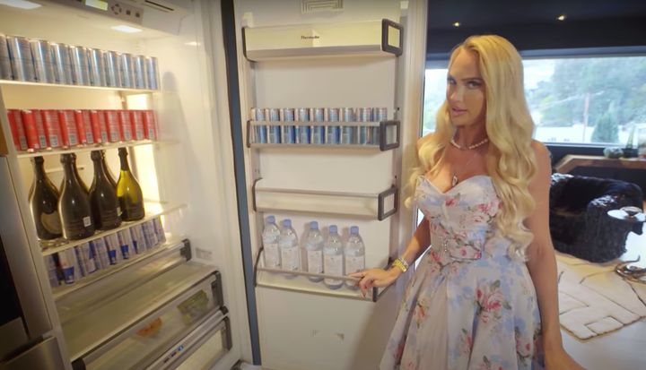 Christine eyes up the contents of her fridge