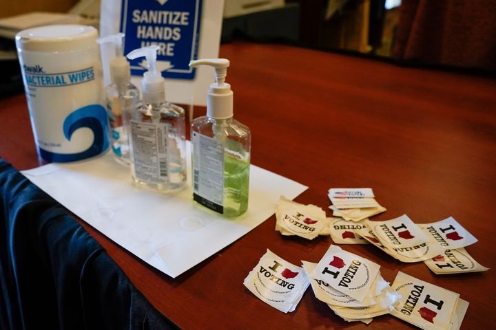 Hand sanitizer can ruin your ballot, so use it judiciously. Above, bottles of hand sanitizer sit on a table at the Butler County Board of Elections office in Hamilton, Ohio, on March 12.