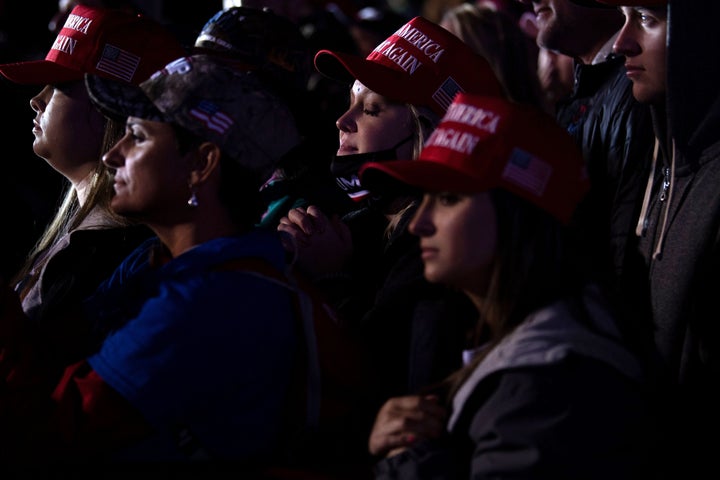 People listen while President Donald Trump speaks during a rally at Richard B. Russell Airport in Rome, Georgia, on Nov. 1, 2020. 