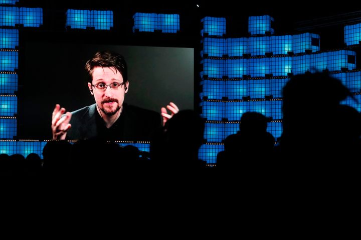 Former U.S. National Security Agency contractor Edward Snowden is seen addressing attendees through video link at a technolog