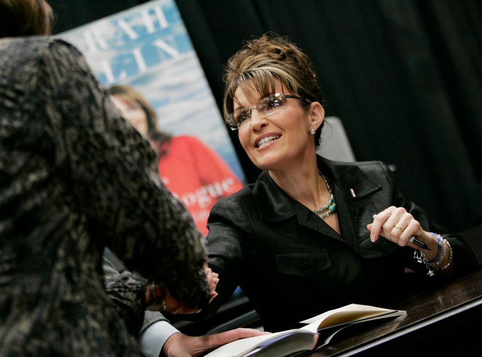 Sarah Palin, former vice presidential candidate and governor of Alaska, signs a book at Sam's Club in Washington, Pa. on Nov. 21, 2009. 
