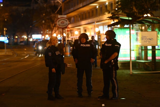 Police stand guard stand near Schwedenplatz square following a shooting in the center of Vienna on November...