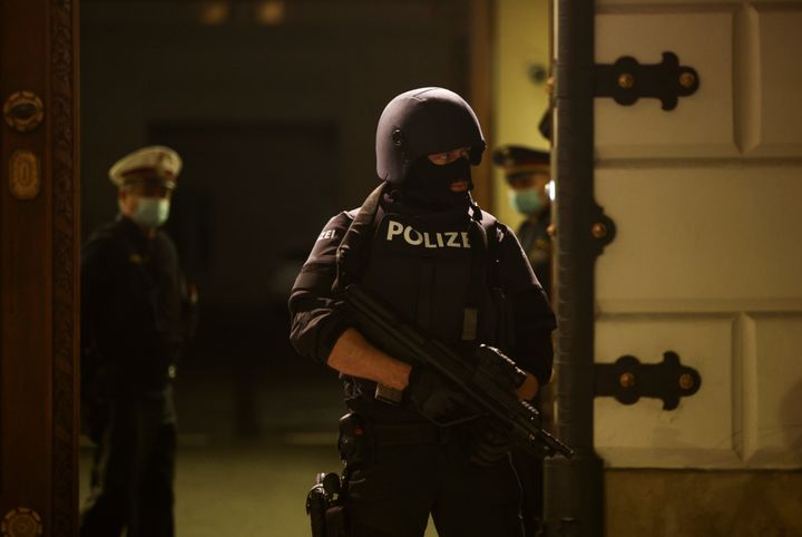 A police officer stands guard in front of the Interior Ministry as a news conference takes place after the attack in Vienna