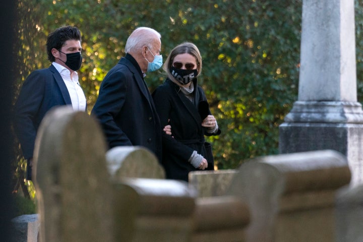 Democratic presidential candidate former Vice President Joe Biden walks with his granddaughter Finnegan Biden into St Joseph