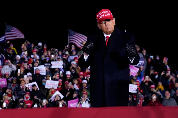 President Donald Trump dances after a campaign rally at Gerald R. Ford International Airport in Grand Rapids, Michigan, early Tuesday morning.