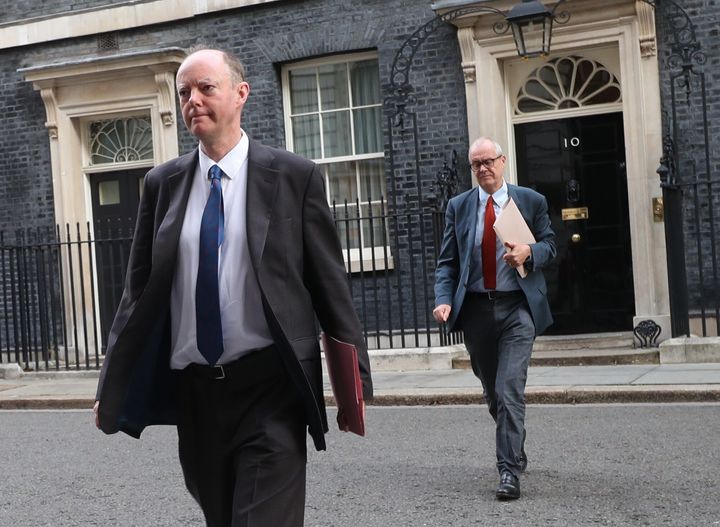The government's chief medical officer Chris Whitty (left) and chief scientific adviser Patrick Vallance leave 10 Downing Street, London. 