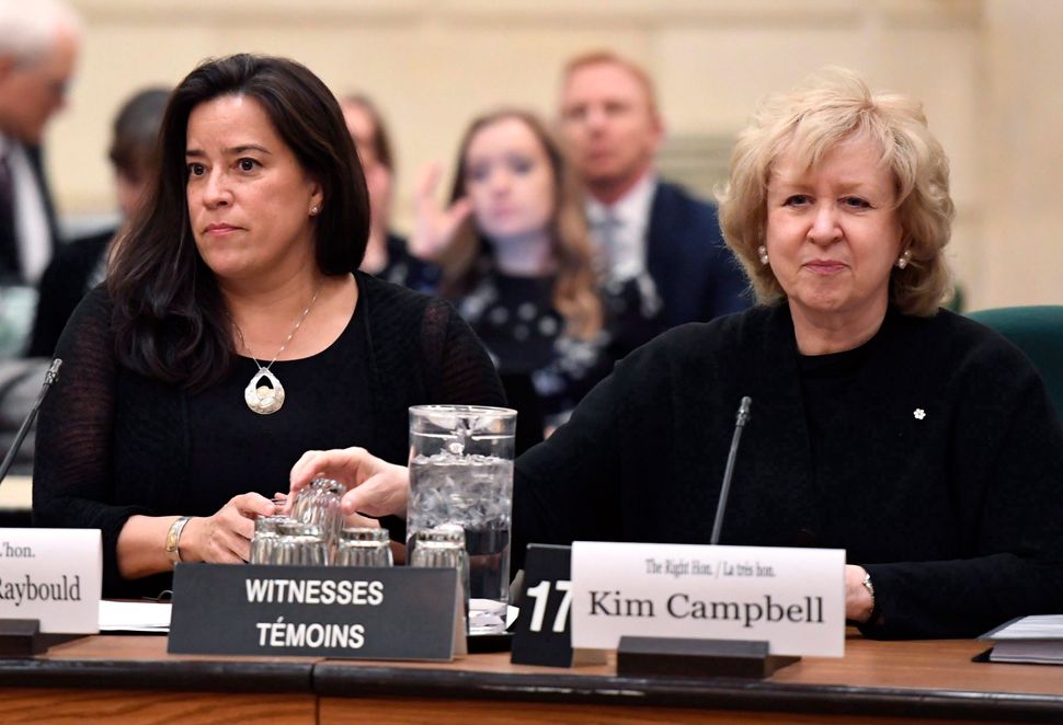 MP Jody Wilson-Raybould, left, and former prime minister Kim Campbell sit beside each other at a House of Commons commitee in Ottawa on the nomination of Sheilah Martin to the Supreme Court on Dec. 4, 2017.