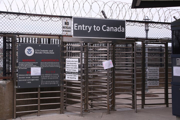 Signs hang on the entrance way to Canada via the Rainbow Bridge in Niagara Falls, N.Y. on March 18, 2020.