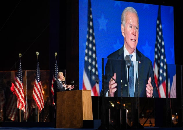 Former US Vice President and presidential nominee Joe Biden addresses supporters at party headquarters...