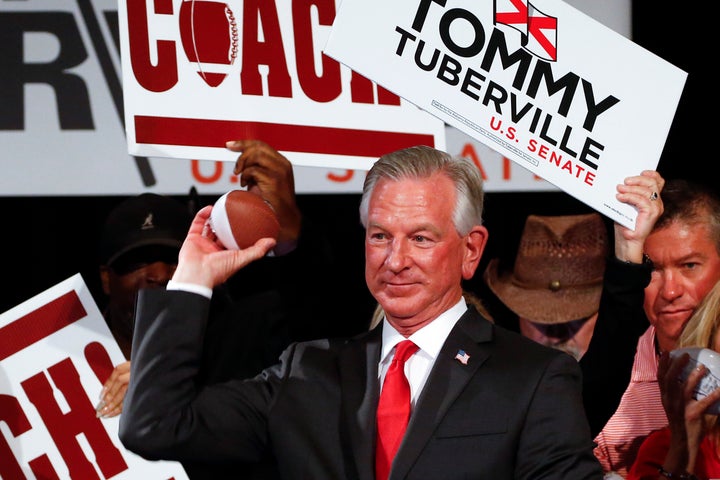 Republican Sen.-elect Tommy Tuberville throws toy footballs to supporters at his watch party in Montgomery, Alabama, on Tuesd