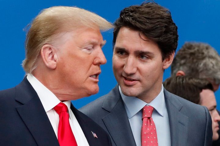 U.S. President Donald Trump and Prime Minister Justin Trudeau talk prior to a NATO round table meeting in England in December 2019.