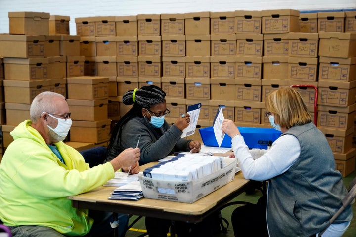 Election workers in Chester County, Pennsylvania, processing mail-in and absentee ballots on Wednesday. President Donald Trump has baselessly claimed that mail-in voting leads to voter fraud and is filing lawsuits meant to stop ballots from being counted.