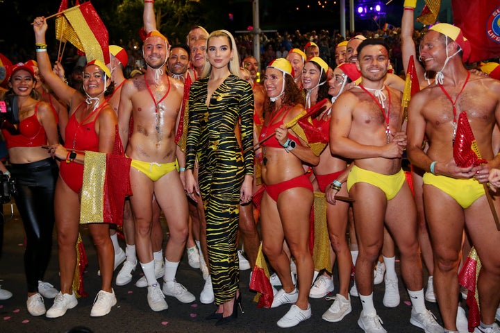 Dua Lipa poses amongst life guards during the 2020 Sydney Gay & Lesbian Mardi Gras Parade on February 29, 2020 in Sydney, Australia. 