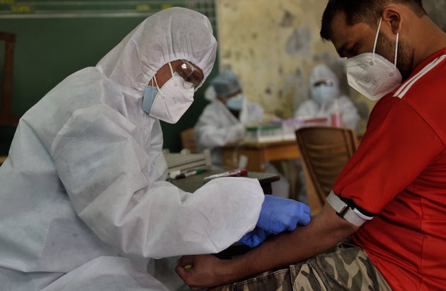 A file photo of a BMC healthcare worker collecting plasma samples from a patient who recovered from Covid-19...