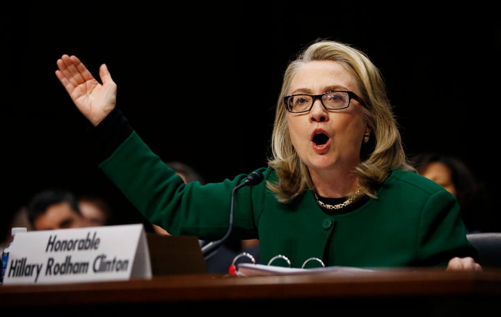 Then-Secretary of State Hillary Clinton pounds on a table responding to Senate Foreign Relations Committee Chair Ron Johnson (R-Wis.) while testifying about the attack on U.S. diplomatic sites in Benghazi, Libya, on Jan. 23, 2013. 