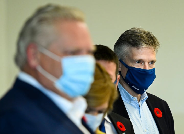 Ontario Finance Minister Rod Phillips, right, and Premier Doug Ford deliver baked goods and coffee to workers at Humber River Hospital Nov. 5, 2020.