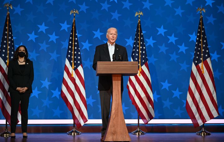 Democratic presidential candidate Joe Biden speaks as Kamala Harris looks on in Wilmington, Delaware.