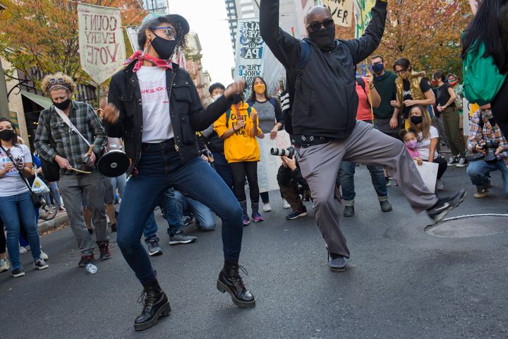 Anti-Trump voters hold a dance party Thursday and demand that every ballot be counted outside the Pennsylvania Convention Center in Philadelphia, where mail-in ballots are being counted to determine the winner of the 2020 presidential election.