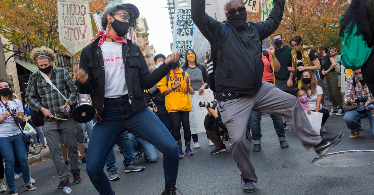 How Pro-Democracy Protesters Drowned Out A MAGA Vote Suppression Campaign