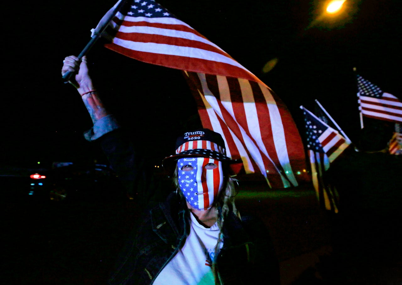 A Trump supporter joins others in protesting the Nevada vote outside Clark County Election Department.