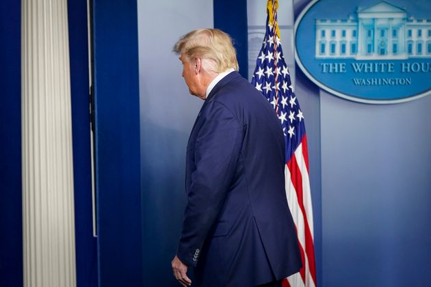 Donald Trump leaves after speaking at the White House on Thursday.