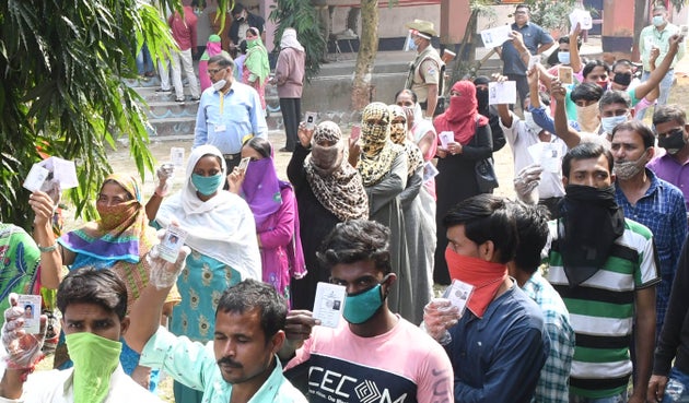 Voters queue for casting their vote during second phase assembly election in Bihar at polling booth of...