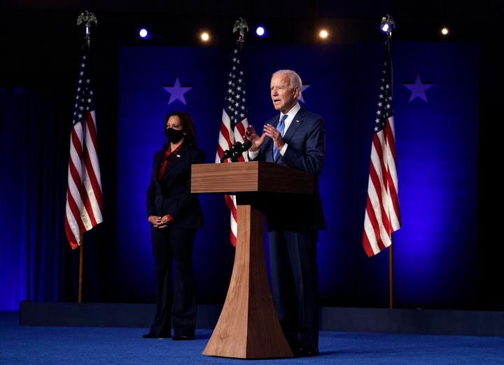Joe Biden speaks on Friday as Democratic vice presidential candidate Senator Kamala Harris listens. 