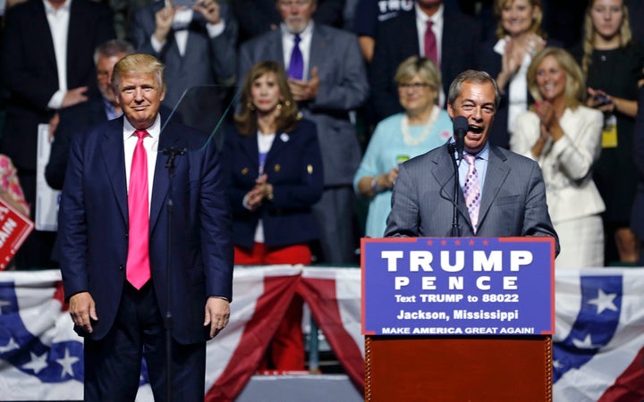 Nigel Farage, ex-leader of the British UKIP party, speaks as Republican presidential candidate Donald Trump, left, listens, at Trump's campaign rally in Jackson, Miss., Wednesday, Aug. 24, 2016. (AP Photo/Gerald Herbert)