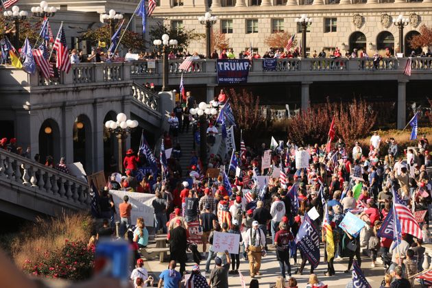 Trump supporters, QAnon believers and members of far-right militia groups gathered outside the Pennsylvania state Capitol, falsely claiming that Biden had won the election due to widespread voter fraud. 