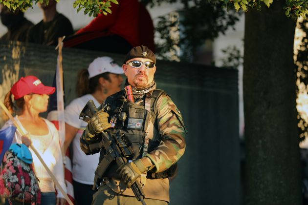 An armed man at a protest in Harrisburg on Saturday. About 2,000 people gathered in the Pennsylvania state capital to show support for President Donald Trump after it was announced that he had lost the 2020 presidential election.  