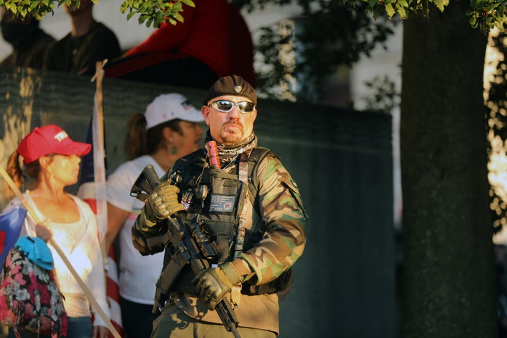 An armed man at a protest in Harrisburg on Saturday. About 2,000 people gathered in the Pennsylvania state capital to show support for President Donald Trump after it was announced that he had lost the 2020 presidential election.