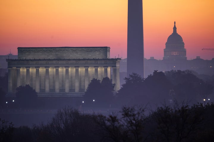 The Washington skyline is seen at dawn, Sunday, Nov. 8, 2020, the morning after incumbent President Donald Trump was defeated by his Democratic challenger, President-elect Joe Biden. From left are the Lincoln Memorial, the Washington Monument, and the U.S. Capitol. (AP Photo/J. Scott Applewhite)