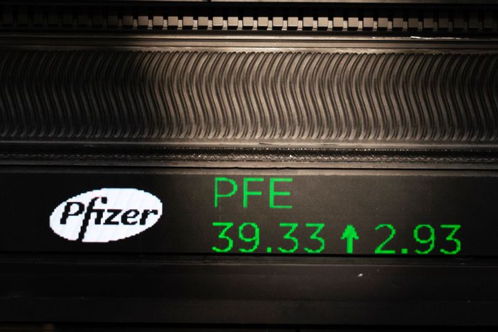 A stock ticker with Pfizer stock information is shown at the New York Stock Exchange, Monday, Nov. 9, 2020. (AP Photo/Mark Lennihan)