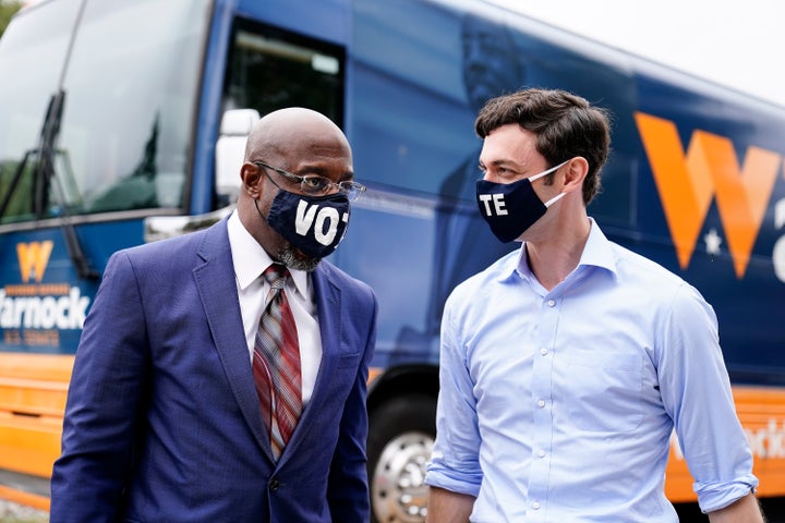 Democratic Senate candidates Jon Ossoff, right, and Raphael Warnock, left, attend a campaign event in Jonesboro, Georgia, in October. Both men will be competing in a January runoff election.