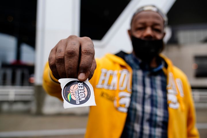 Gary Ragland, 64, votes for the first time at Atlanta's State Farm Arena during early voting in October. Georgia voters will once again head to the polls in January to determine the winners of two Senate seats after no candidate received enough votes to win.