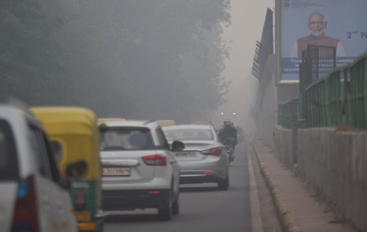 Traffic moving along RK Ashram on a hazy smog ridden day on November 9, 2020 in New Delhi, India.