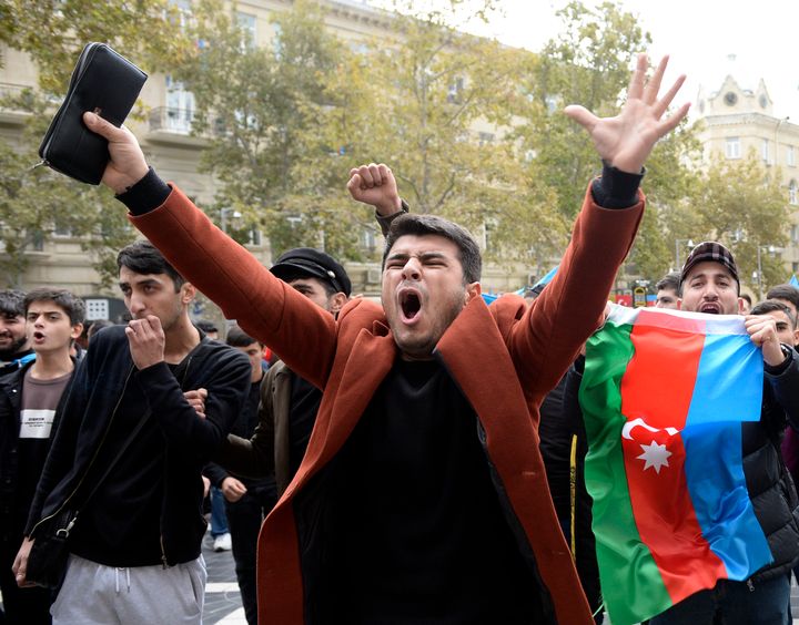 Azerbaijanis celebrate with national flags in Baku, Azerbaijan, on Nov. 10, 2020. 
