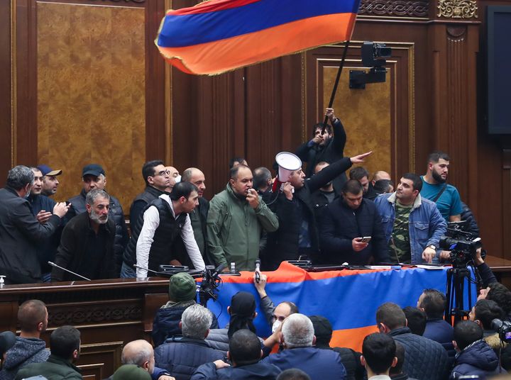 YEREVAN, ARMENIA - NOVEMBER 10, 2020: Demonstrators protesting against the end of war in Nagorno Karabakh break into the building of the National Assembly of Armenia (parliament). On 10 November 2020, Armenia's prime minister Pashinyan, Russia's president Putin and Azerbaijan's president Aliyev signed an agreement to end the war in Nagorno Karabakh. Stanislav Krasilnikov/TASS (Photo by Stanislav Krasilnikov\TASS via Getty Images)