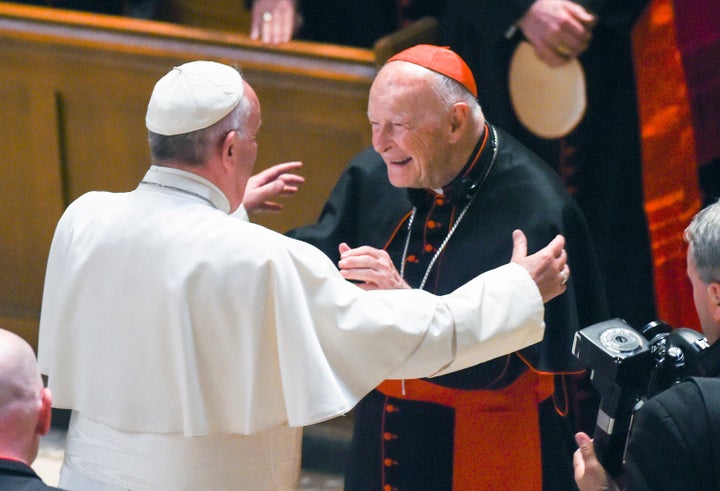 In this Sept. 23, 2015 file photo, Pope Francis reaches out to hug Cardinal Archbishop emeritus Theodore McCarrick after the 