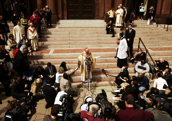 In this photo from April 1, 2005, then-Cardinal Theodore McCarrick answers questions from the media following an afternoon ma