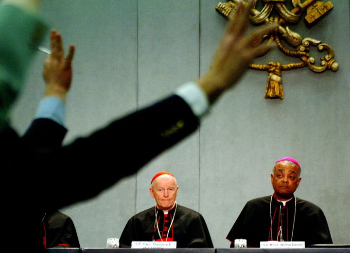 In this photo from April 24, 2002, then-Cardinal Theodore McCarrick answers questions from journalists about what the Catholi