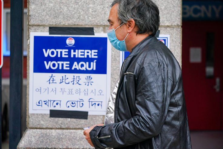 A sign in multiple languages at an early voting site in New York City on Oct. 24, 2020. AAPI advocates say providing resources in different languages is helpful, but not enough to engage voters.