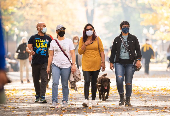 People wear face masks in New York City's Central Park on Nov. 9, 2020. 