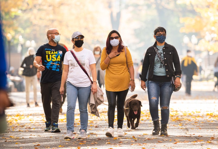 People wear face masks in New York City's Central Park on Nov. 9, 2020. 