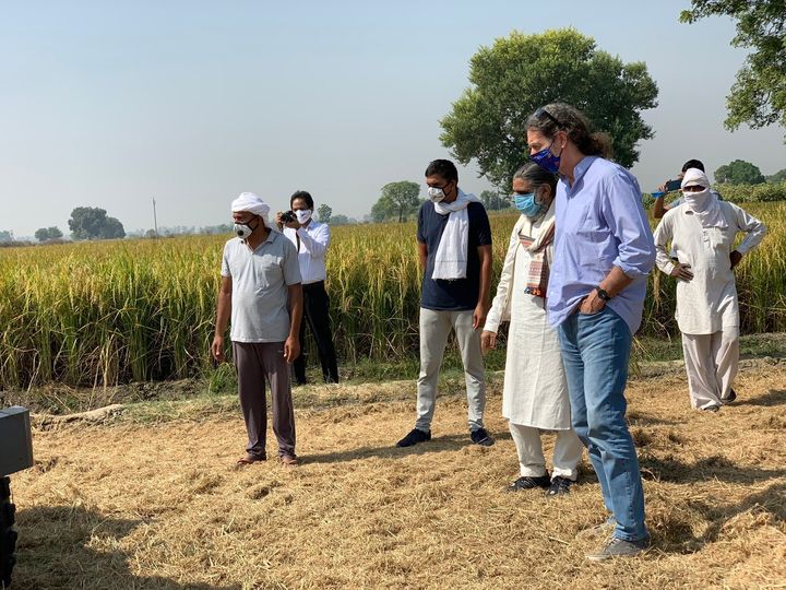 Lindner, along with farmers, checks stubble management machines at a village on the Punjab and Haryana border.