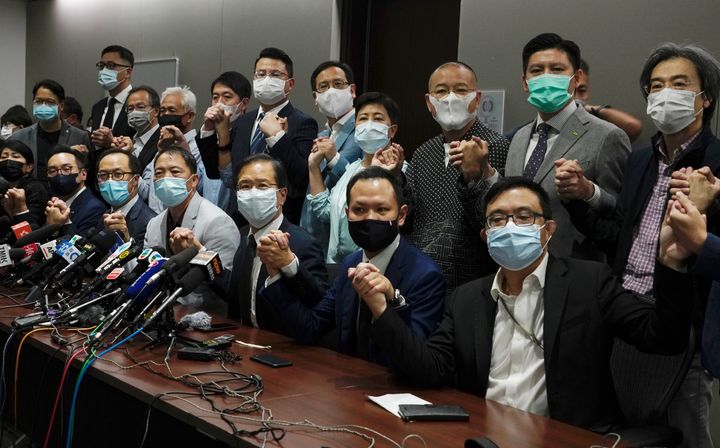 Hong Kong's pro-democracy legislators pose for a photo before a press conference at Legislative Council in Hong Kong on Nov. 