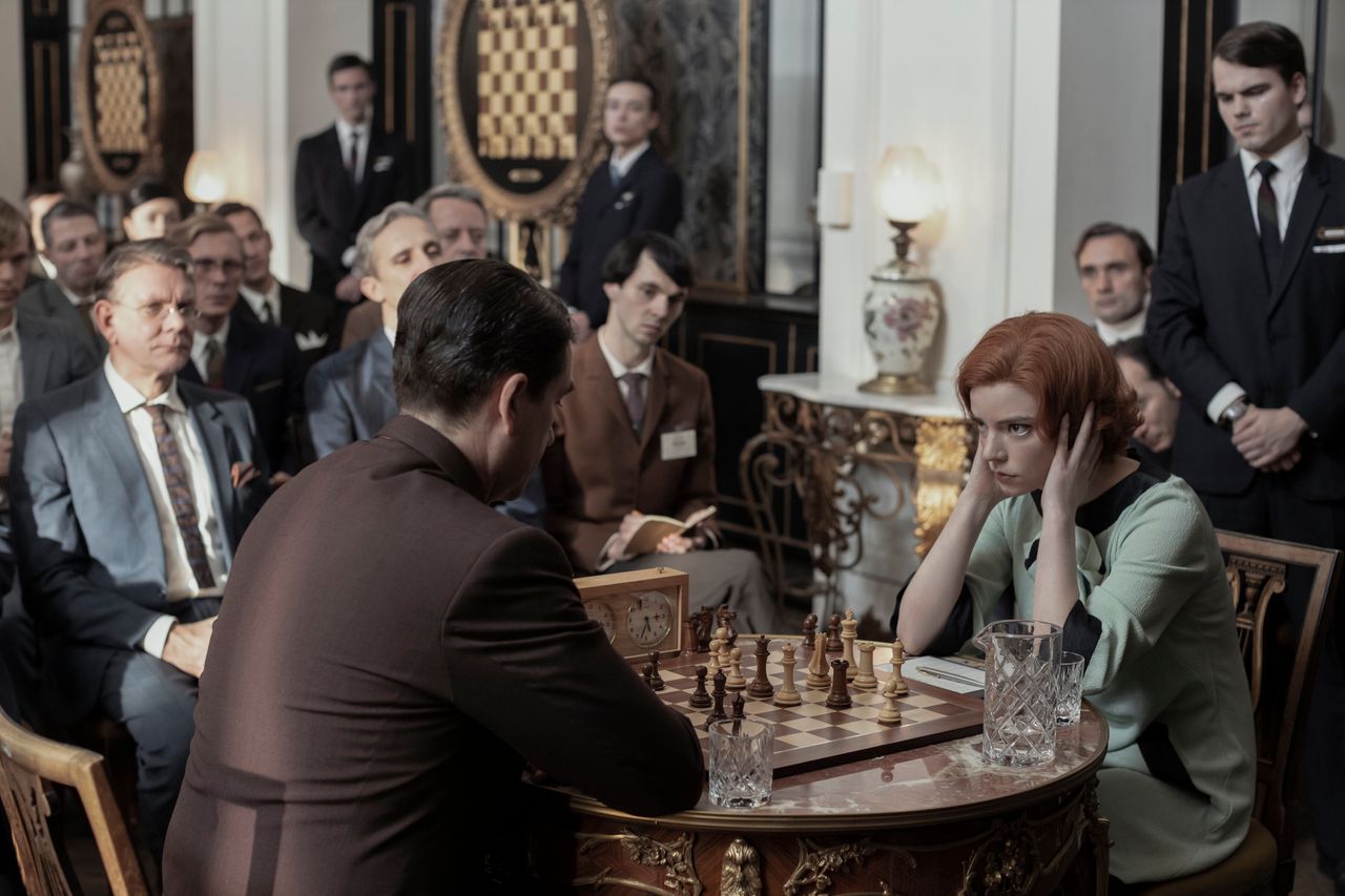 Beth facing Russian chess legend Vasily Borgov, played by Marcin Dorociński in The Queen's Gambit
