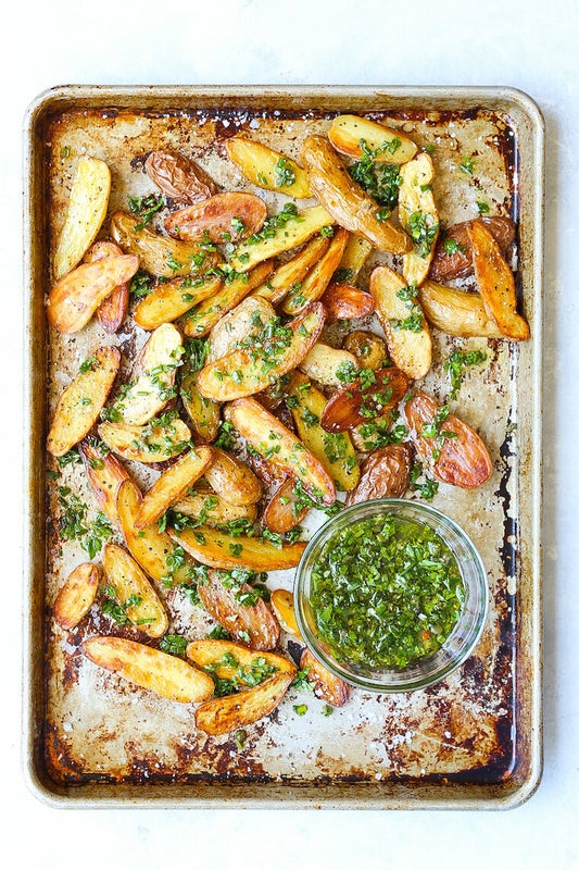 Baked Garlic Herb Potato Wedges from Damn Delicious